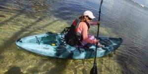 Woman in single kayak