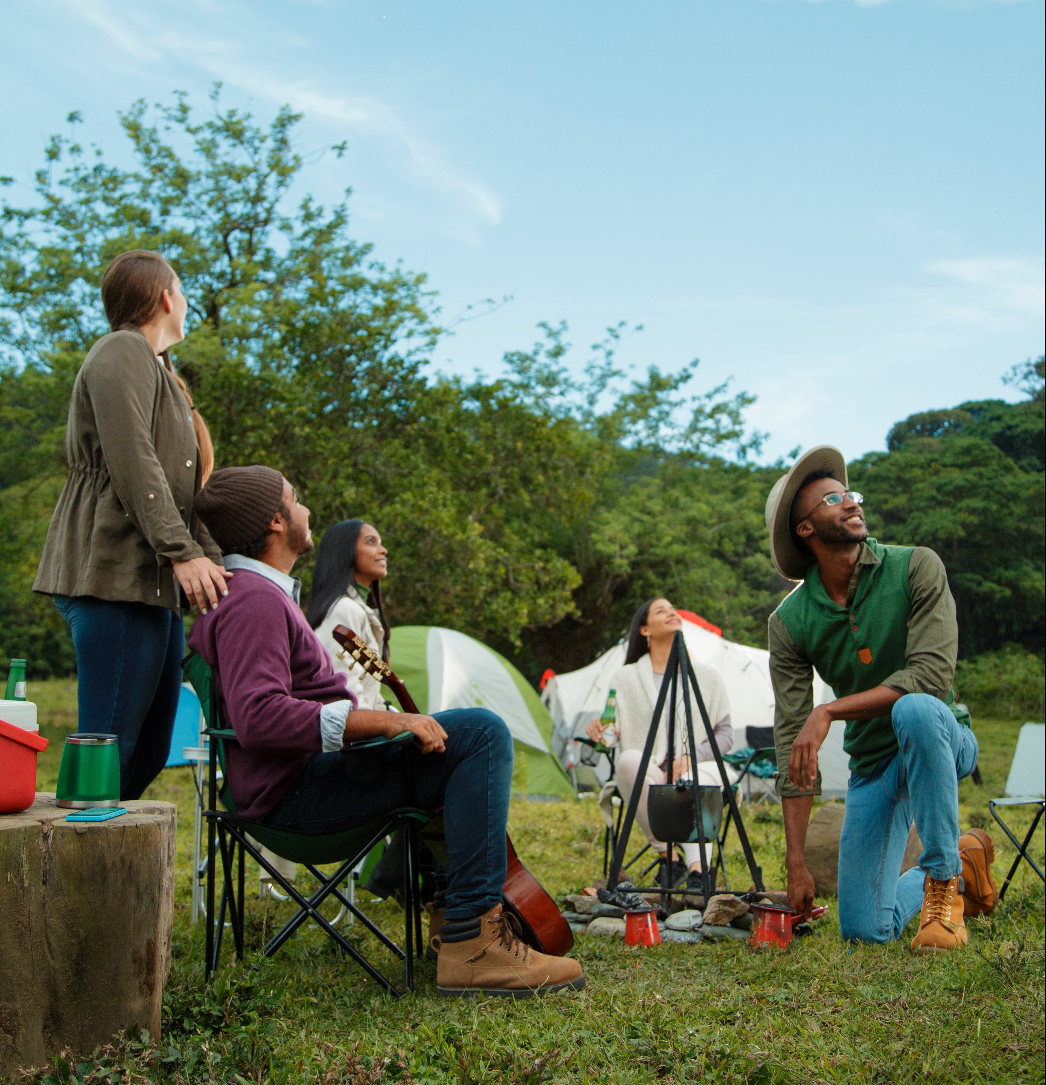 People camping and admiring the clear blue sky